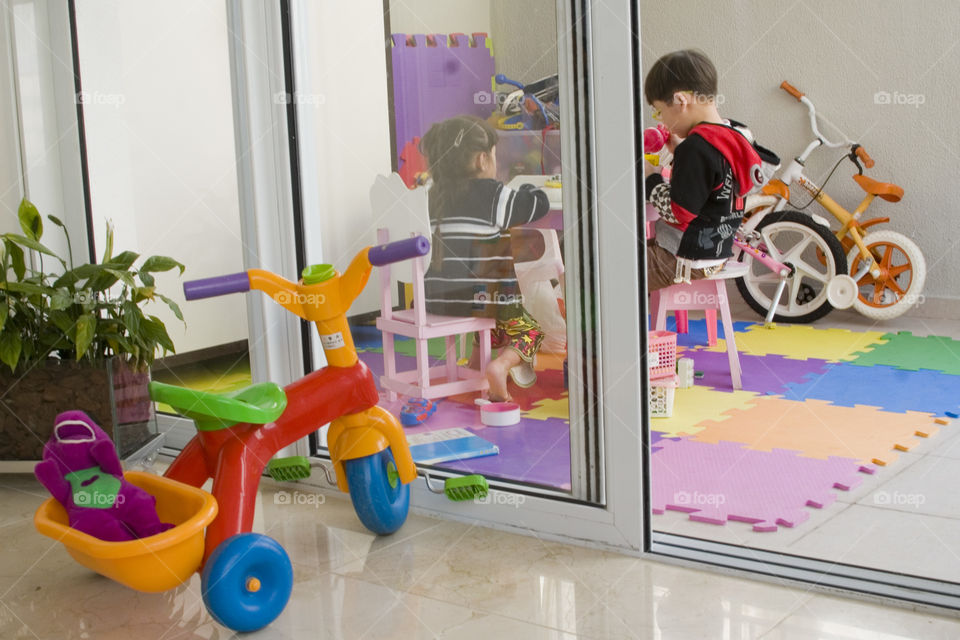 Children playing together in a room