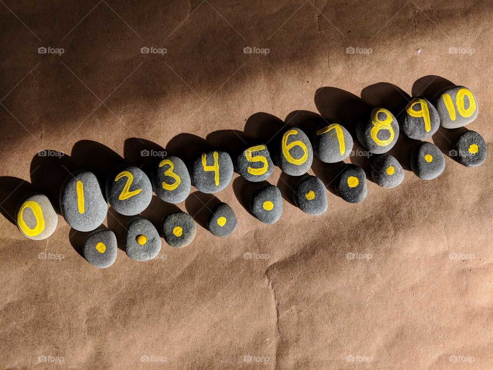 numbers on handmade number stones