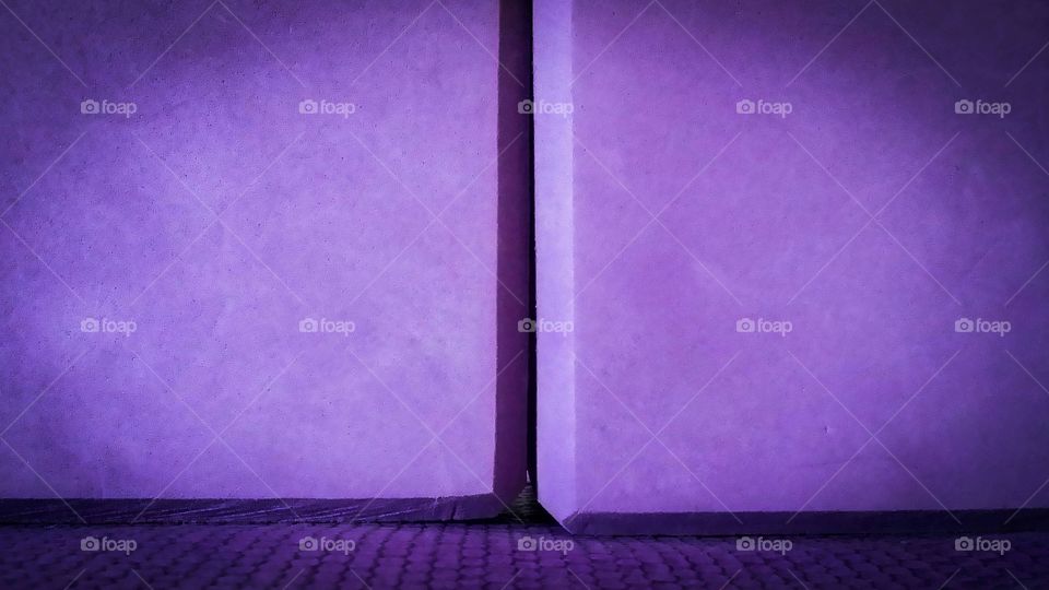 Purple yoga blocks up close on a yoga mat