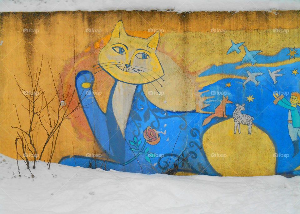 street art on a wall blue and yellow world