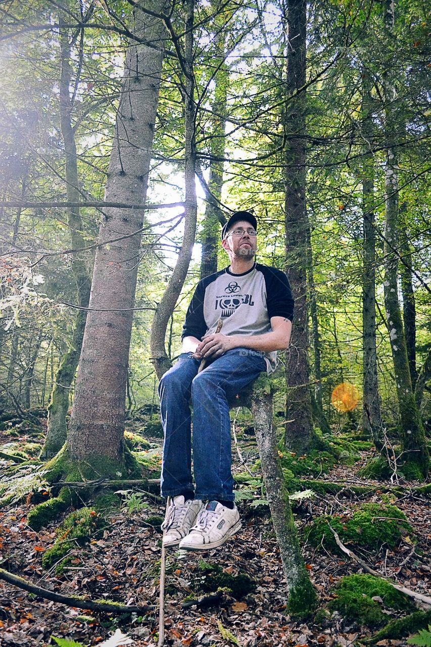 Man sits and enjoy the forest