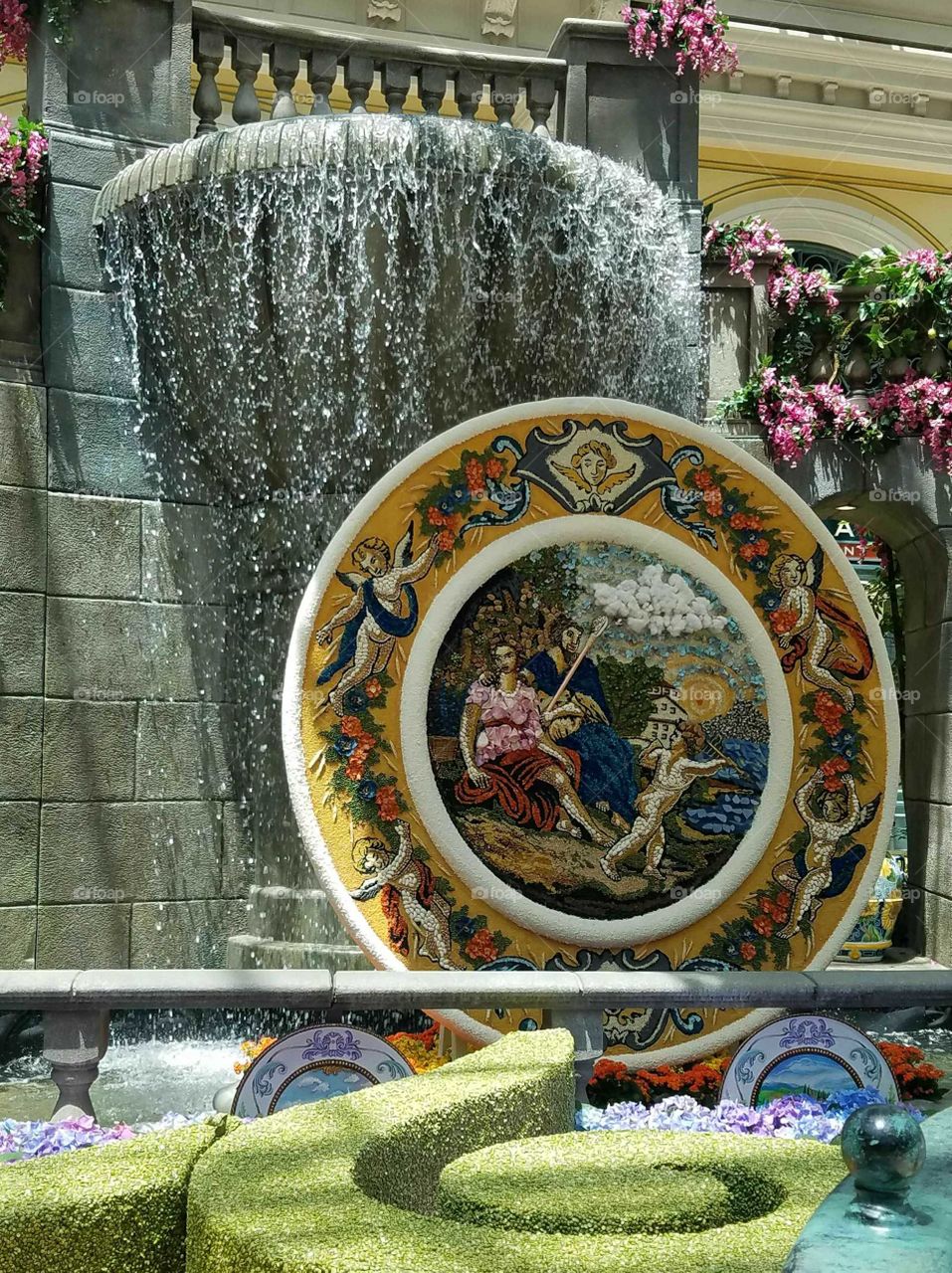 waterfall with the large plate made out of flowers