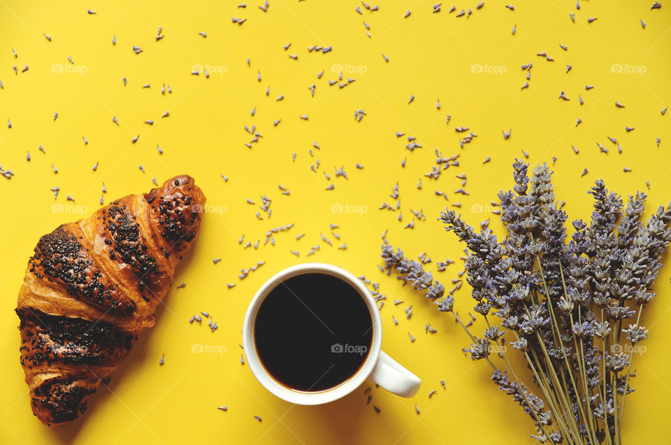 Businessman working morning with cups of hot coffee and lavender bouquet on yellow background. Flat lay, top view.