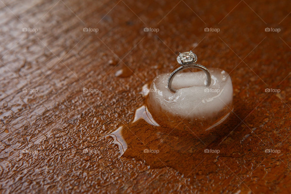 Diamond ring melting away in ice cube