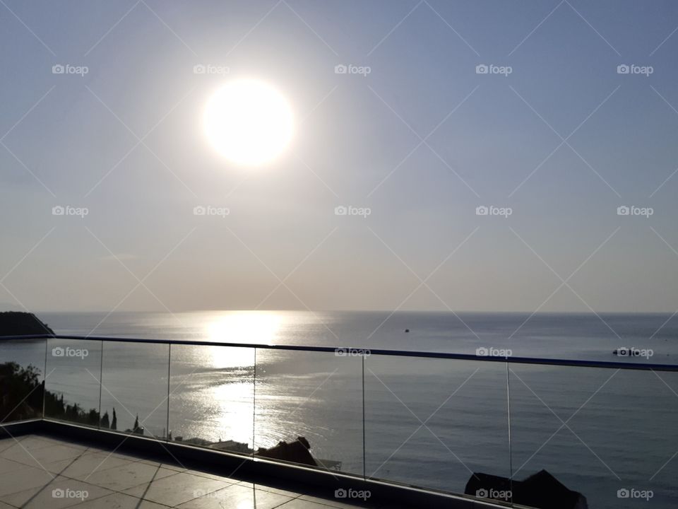 the sun is reflected in the sea