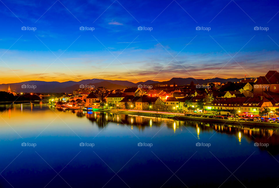 Twilight cityscape . Twilight cityscape of Maribor by the river after sunset, Slovenia 