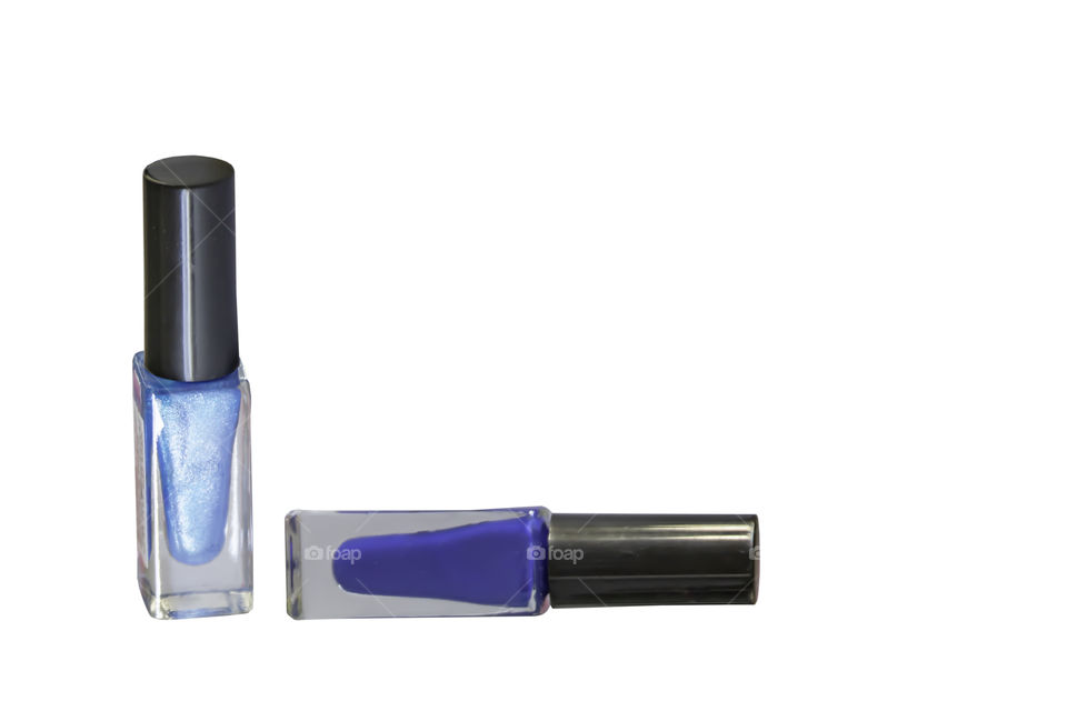 Blue bottle of nail polish on a white background.