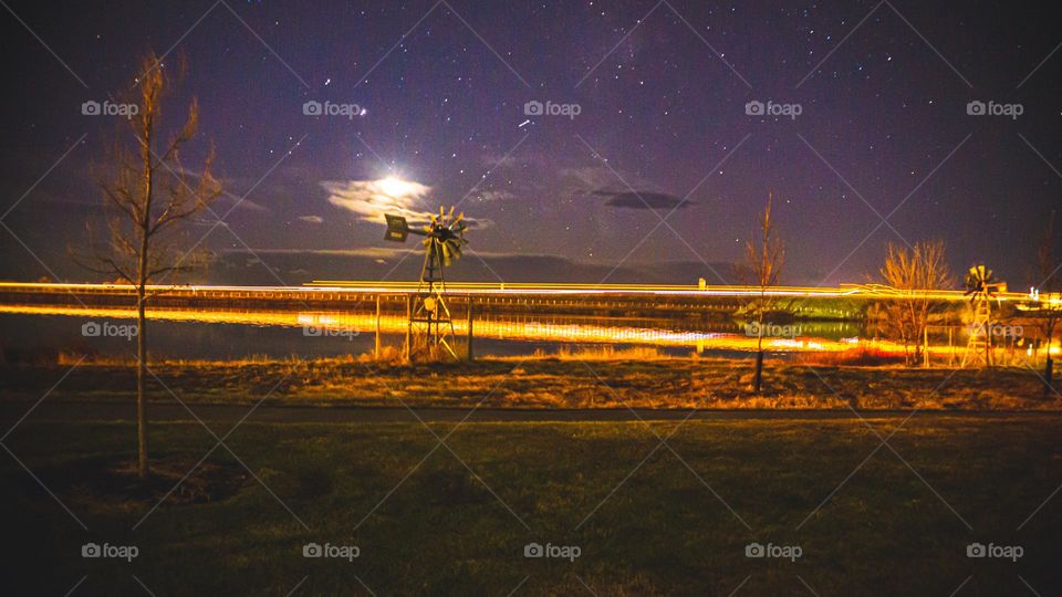 Long exposure working highway over lake.