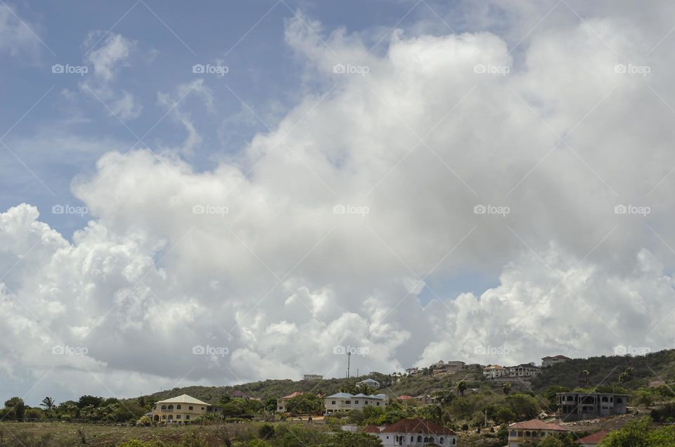 Cumulus Clouds Over The Horizon