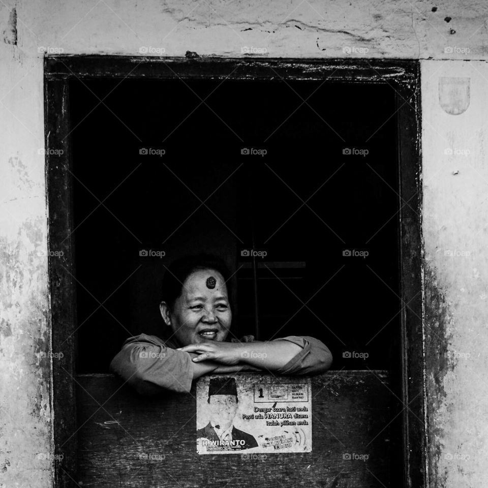 a mother who sees children playing outside the house smiling