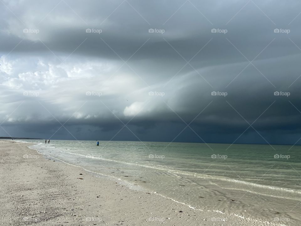 Dark cloud approaching island