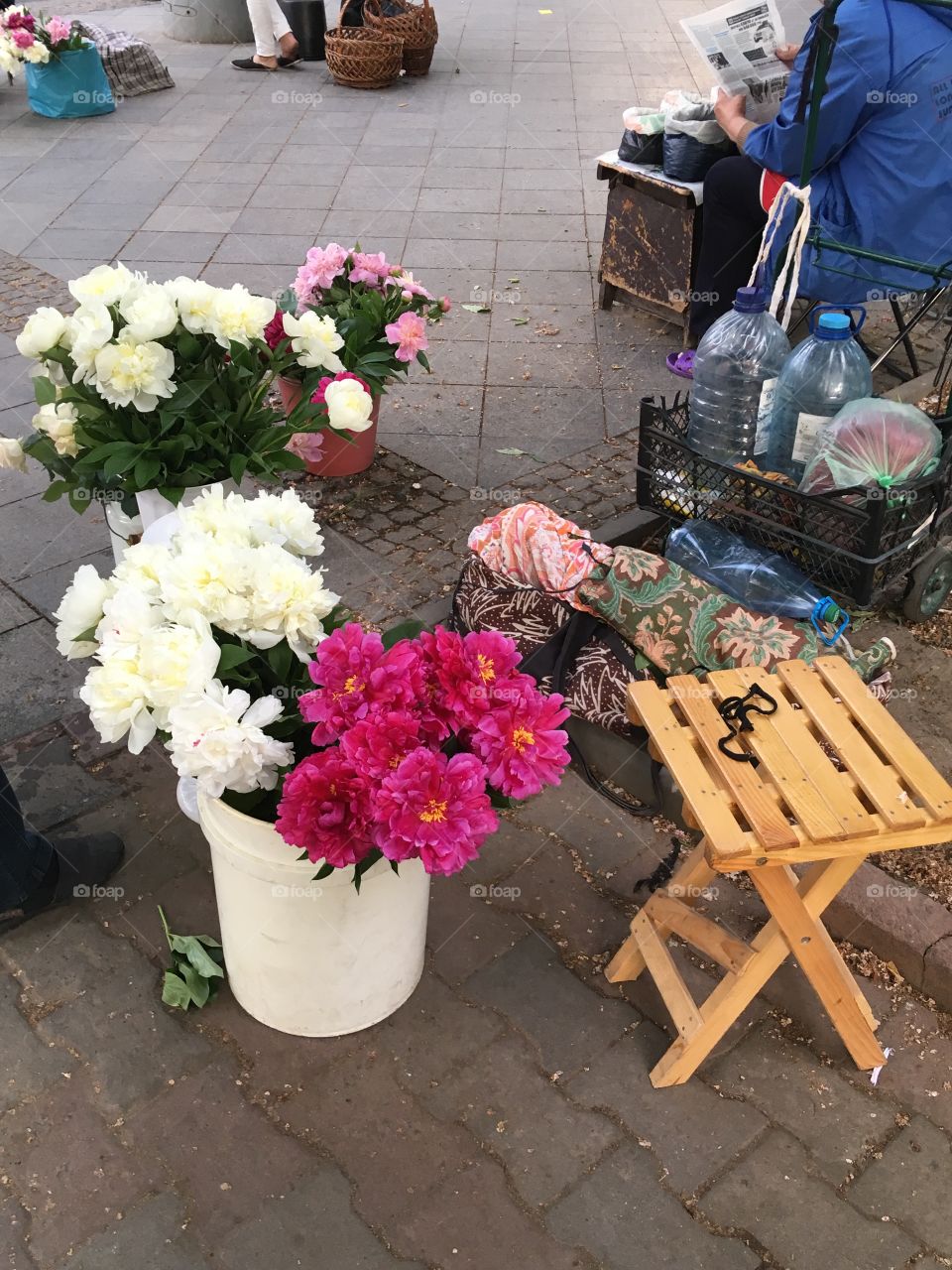 Someone selling flowers. Peonies. 