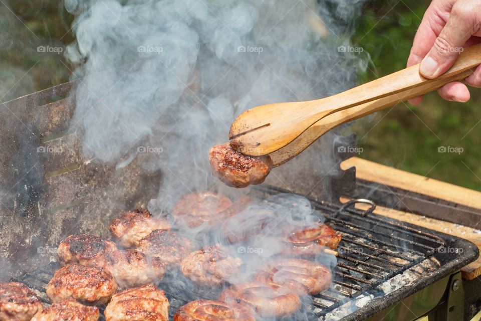 Enjoying the suny day and having barbecue outdoor 