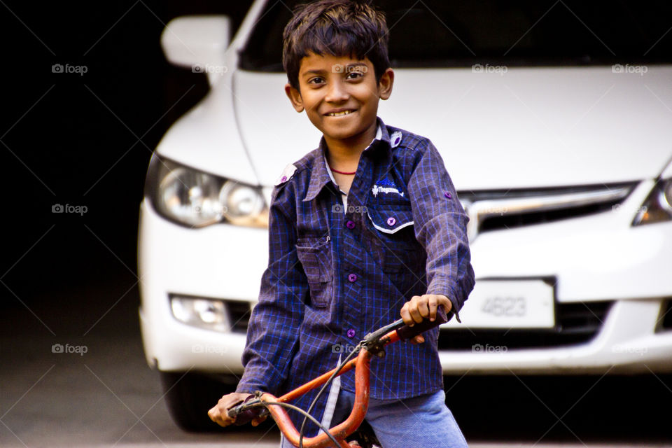 Smiling kid, cycling kid, happy kid