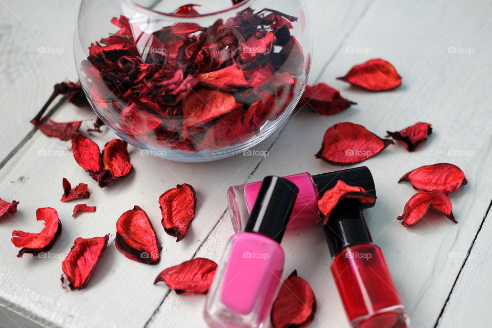 Beauty, health, spa and personal care: nail polish, flowers, rose petals