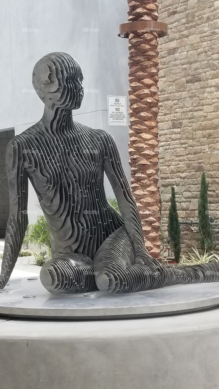 Metal sculpture of woman