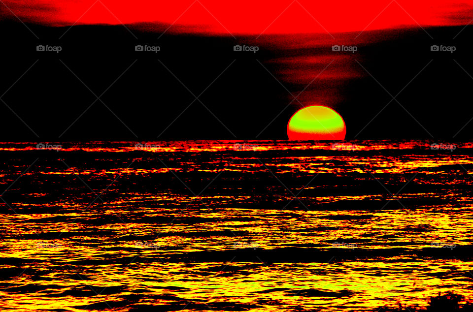 Dark red golden time is a result of an amazing sunset over a sea...