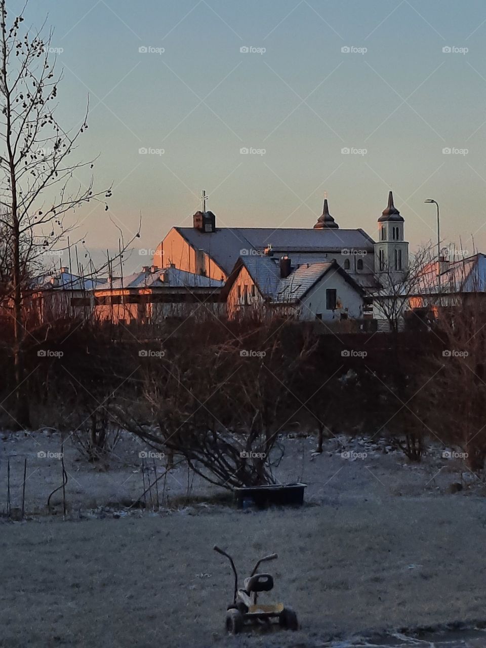 early morning sunshine illuminating local church