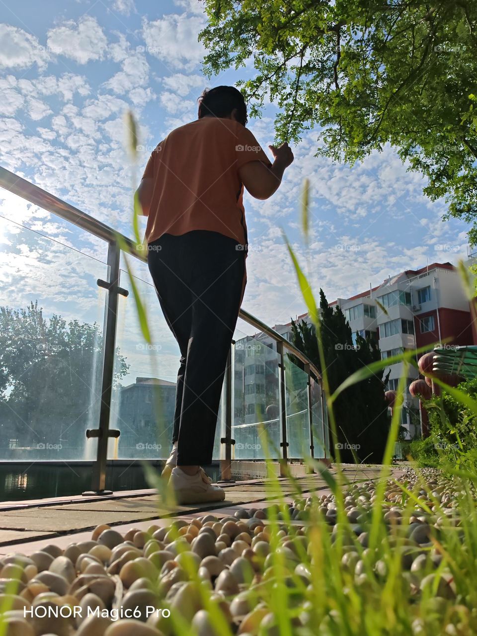 This photo features a person exercising in the morning from a low angle, conveying the message that physical health and happiness are paramount. It emphasizes the importance of taking care of one's body. taken in China and is intended for comme.