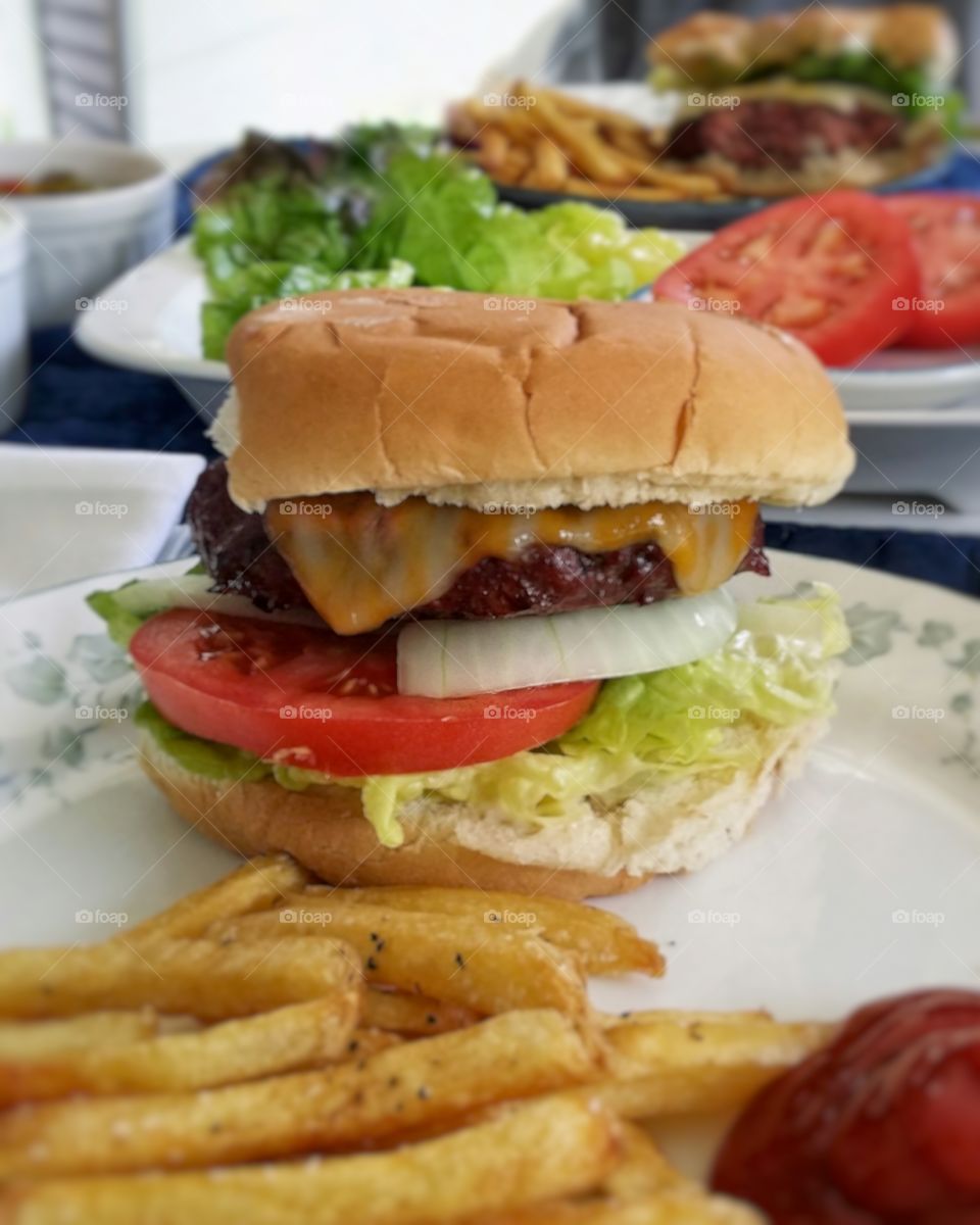 Homemade cheeseburger and french fries