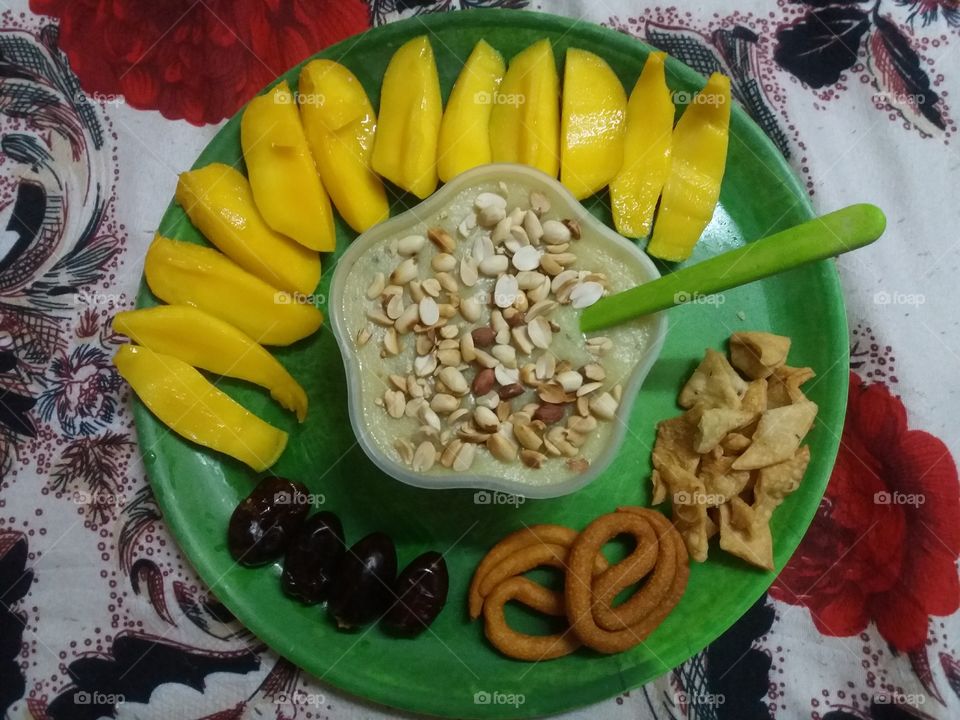 Mango with dry fruits in breakfast 😋