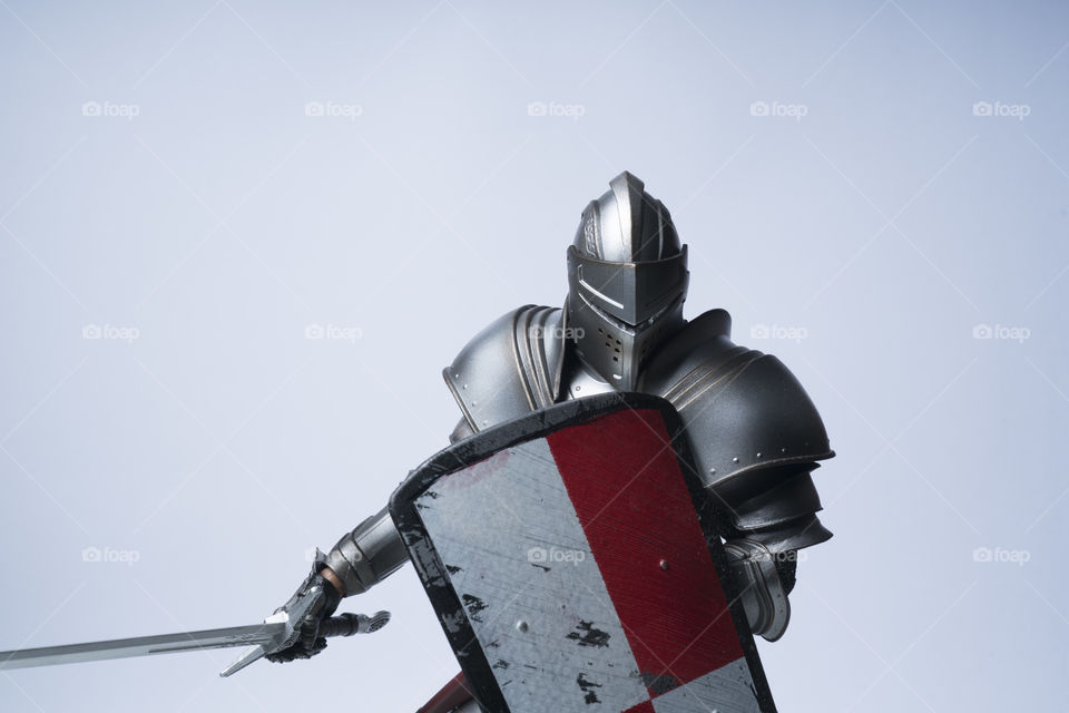 Knight with red and white checked shield