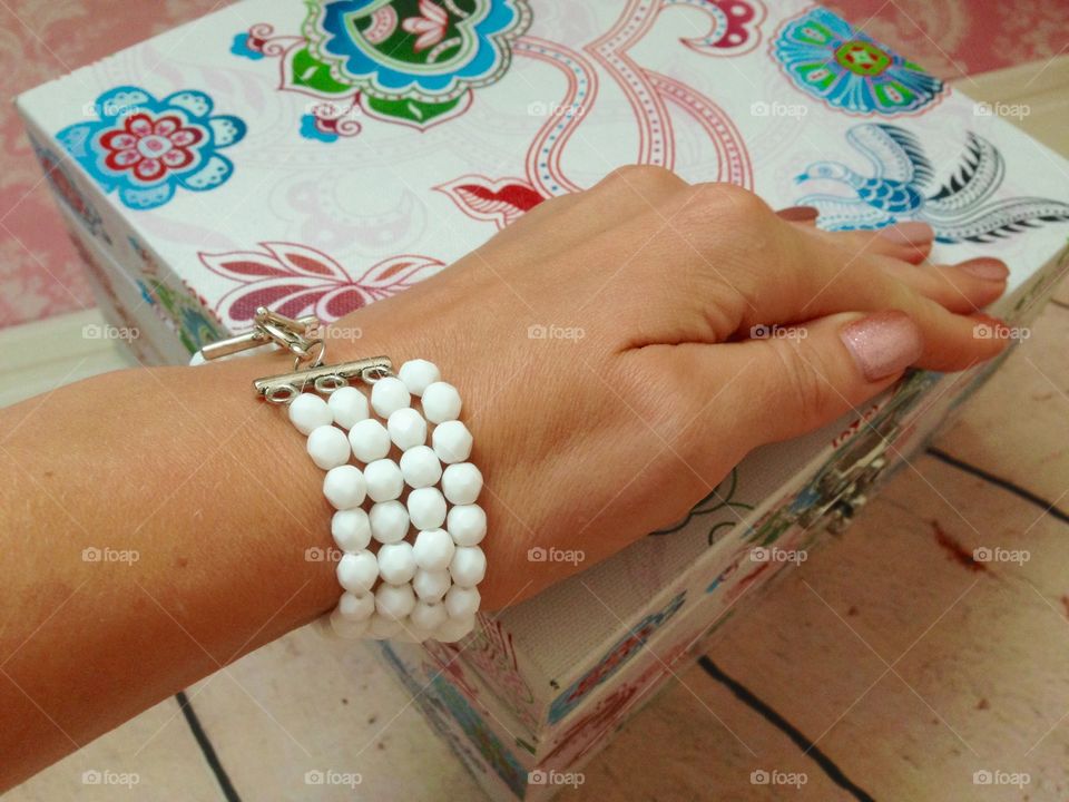 White bracelet and colorful box