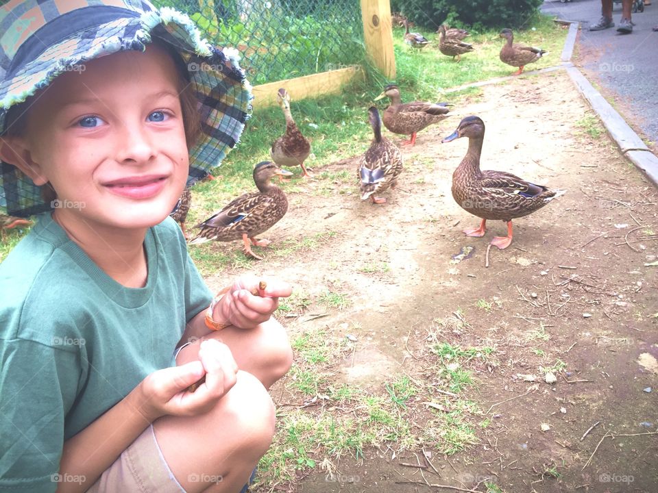 Boy with mallard duck