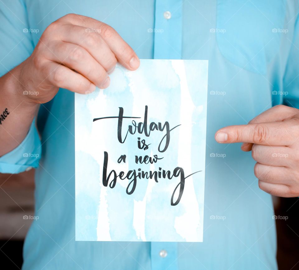 person in blue shirt with motivational quotes