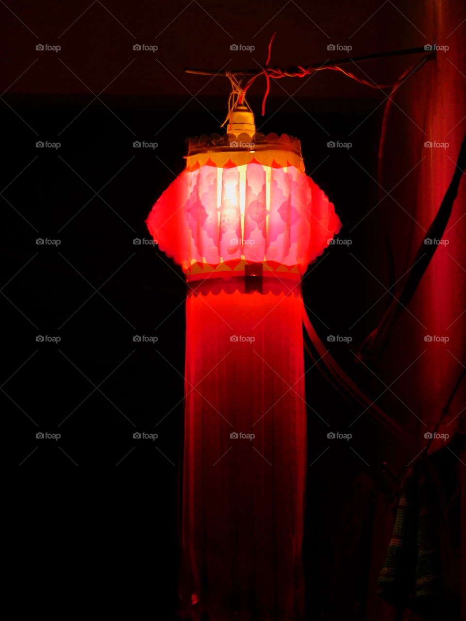 Red coloured lantern with dark black background used for decoration in Indian festival Diwali.