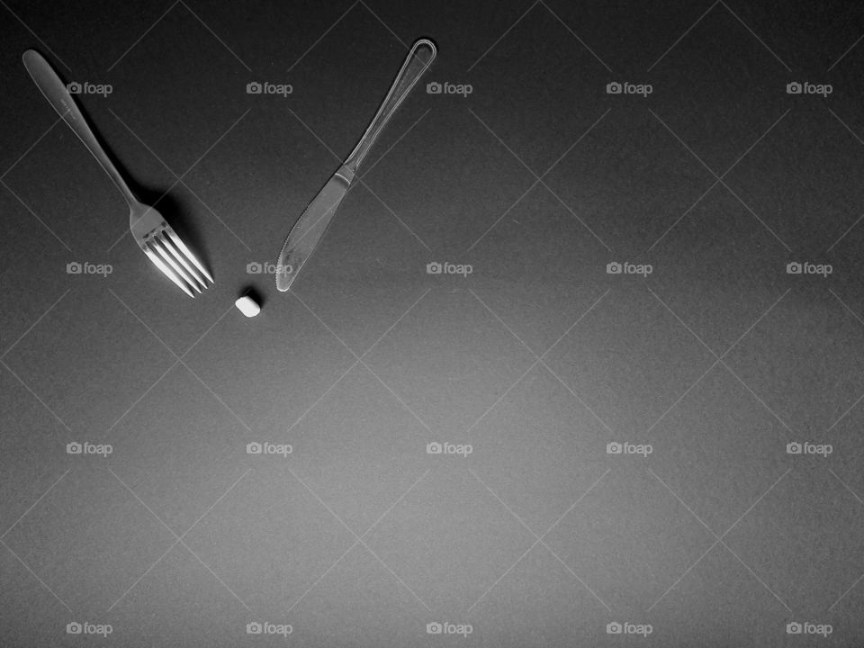 Eating utensils on gray background