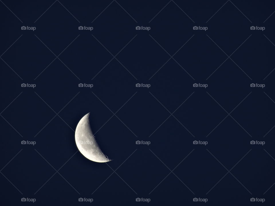 The crescent moon in the space