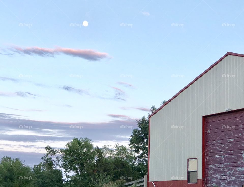 Full moon over a barn