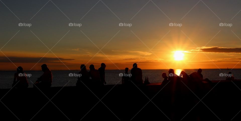 People enjoying the sunset in Malmö.
