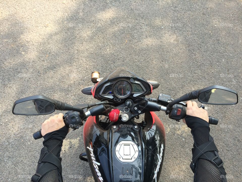 By bike. Riding motorcycle