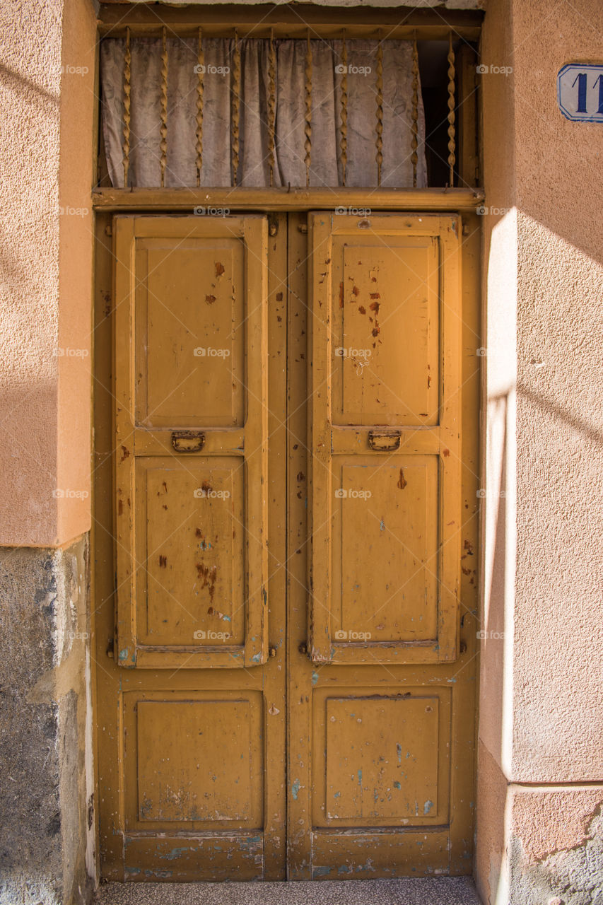 Old door in the city of Cefalu on Sicily.