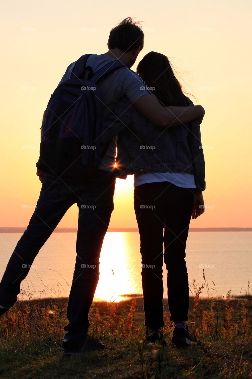 silhouette couple in love on the sunset