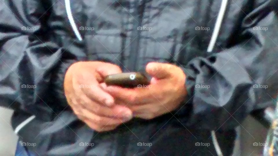 Man texting. man texting by his phone