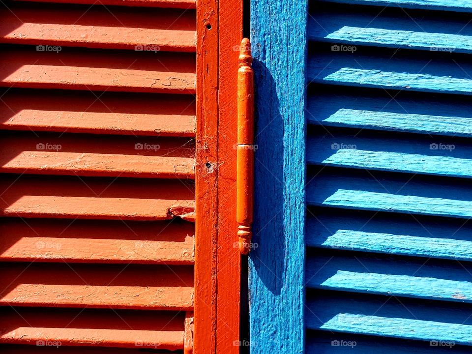 red and blue window shutters