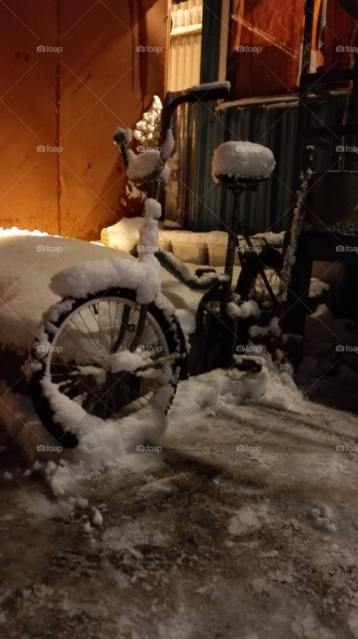 the bike covered with snow