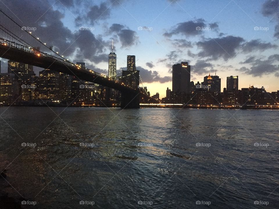 Brooklyn Bridge and Manhattan. Brooklyn Bridge and Manhattan skyline at sunset