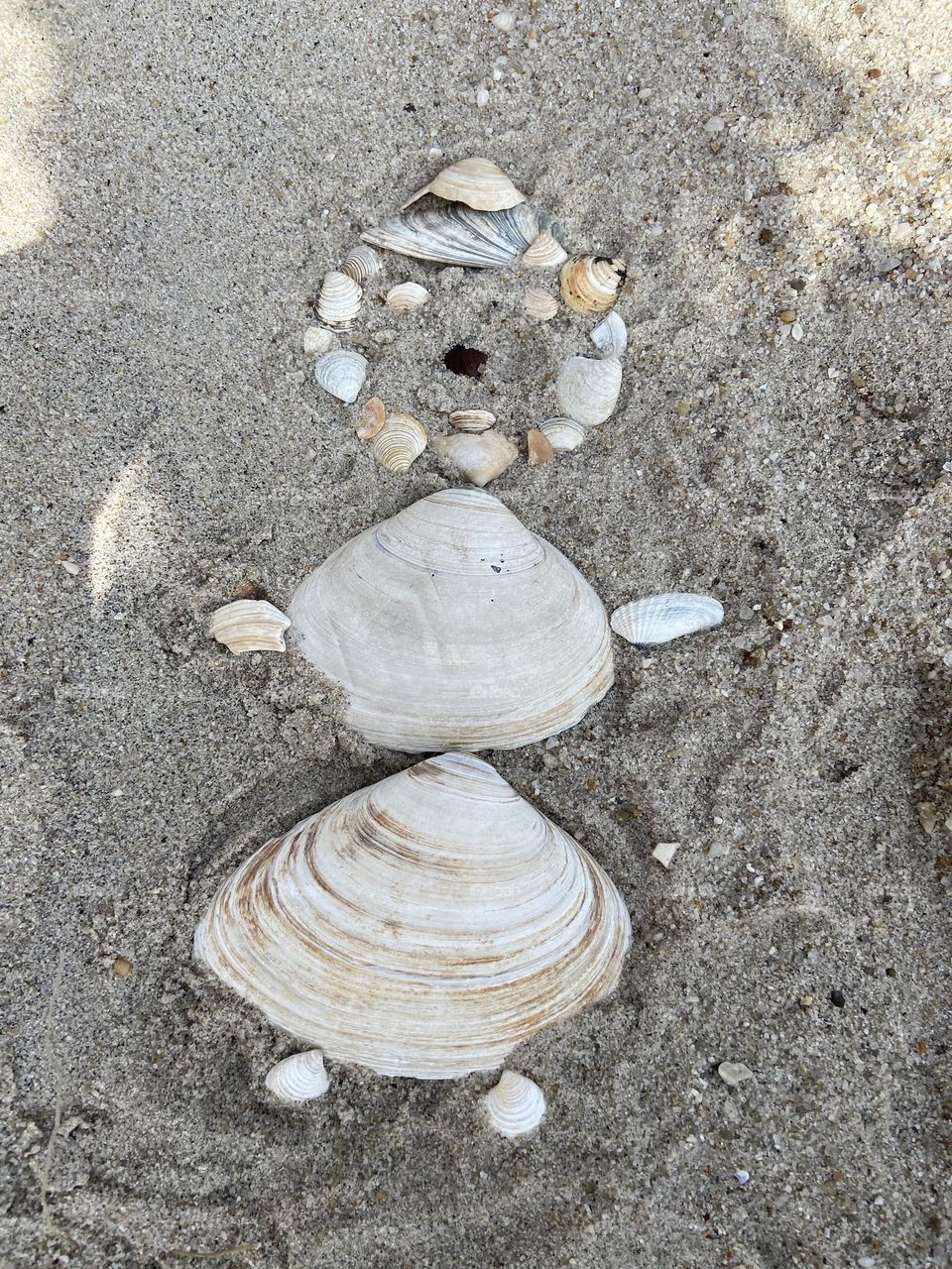 Seashell woman in the sand. Photo of a seashell woman I made while enjoying the morning at a beach in Lavallette, NJ. You’re never too old to play in the sand! Don’t forget to make time for fun!