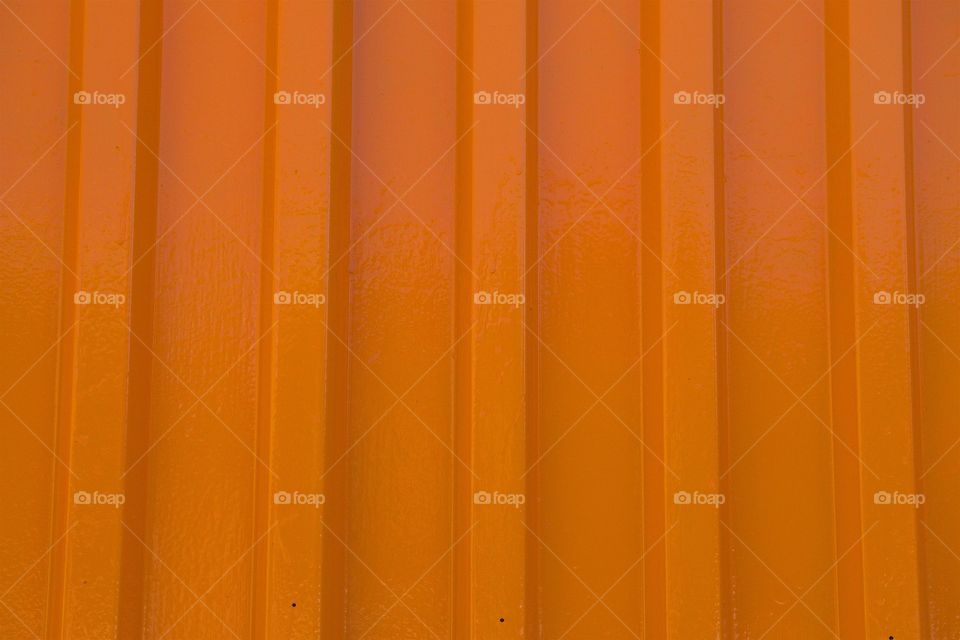 A metal textured orange fence