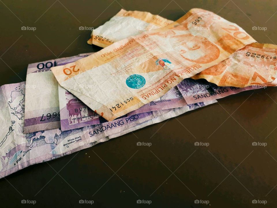Philippines' peso bills. Crumpled yet valuable.
