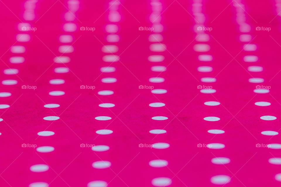 Polca dots on pink paper