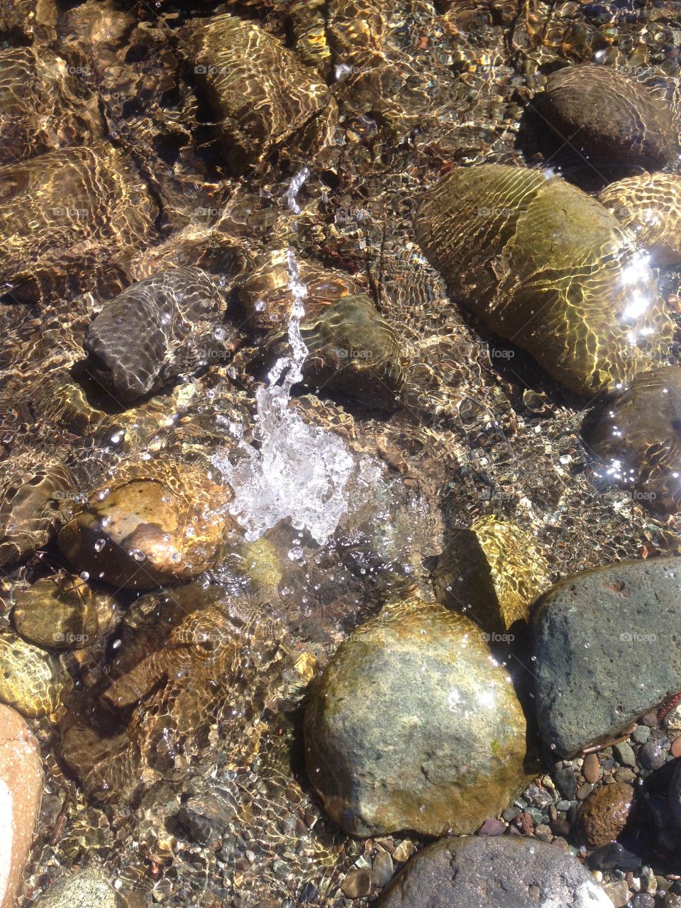 Water splashing in a river. 