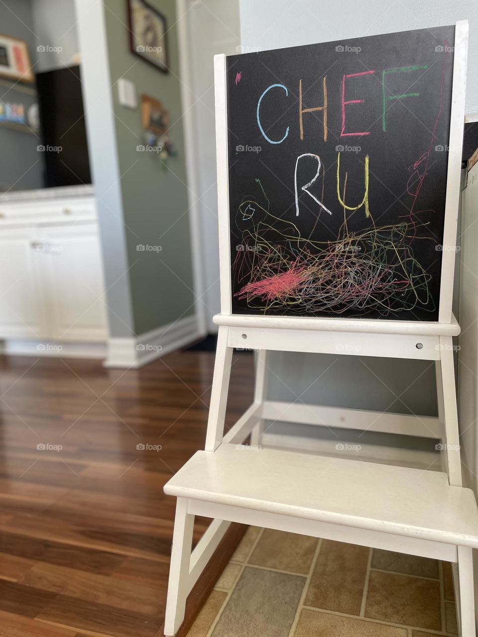 Toddler decorates stand, toddler stand in kitchen, toddler decorates with chalk, celebrating art with toddlers 