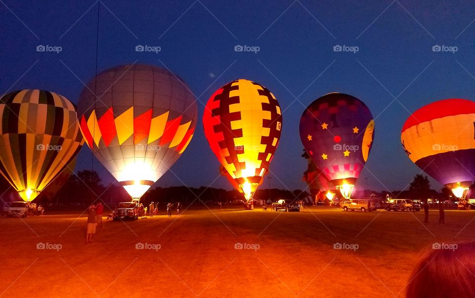Hot air balloon illumination at a festival.