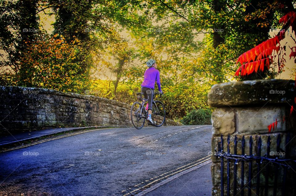 Cyclist cycling up hill