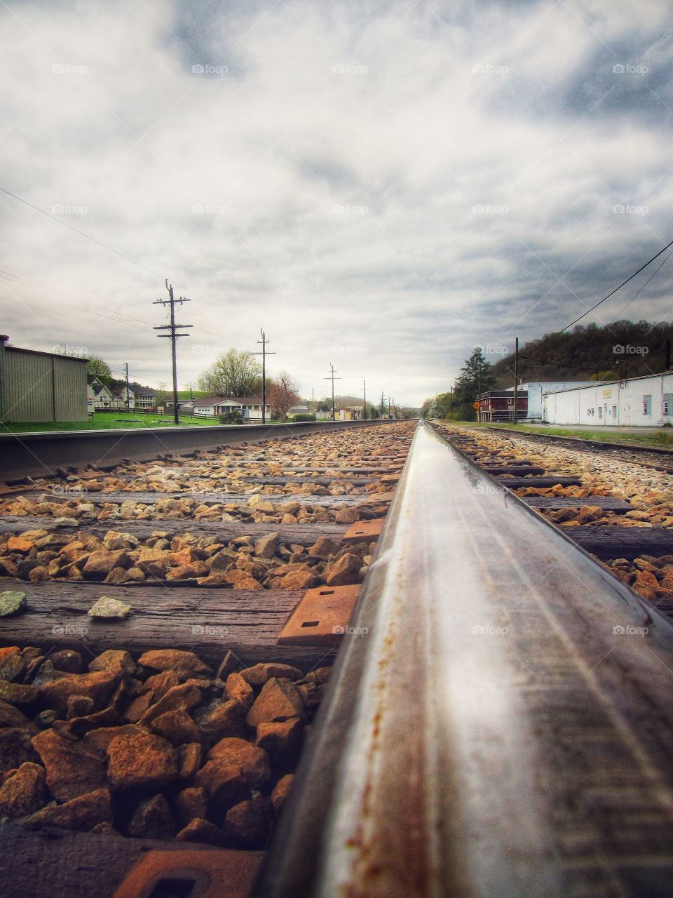 Old Train Stop in my town, old rustic train tracks on a cloudy rainy day